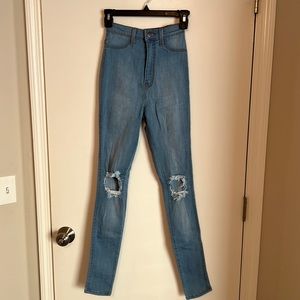 Vibrant MIU Jeans. Light wash. Ripped knee